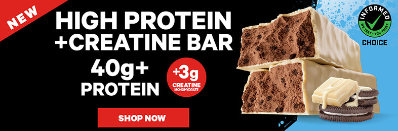 Promotional graphic for a high protein creatine bar. The image features a stack of two chocolate-topped protein bars, one with white chocolate drizzle and one with Oreo cookie pieces, set against a split black and blue background with text reading 'HIGH PROTEIN +CREATINE BAR 40g+ PROTEIN' and a red 'SHOP NOW' button.